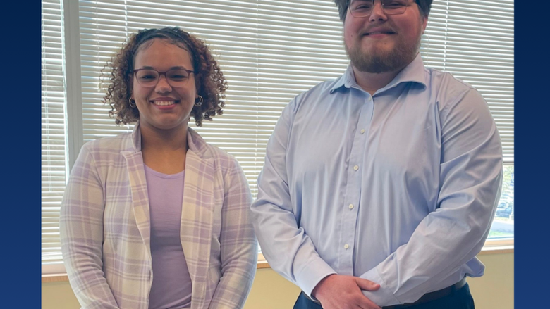 a male and female college student smiling 