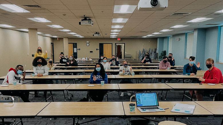 Students in 艾琳Grodziak's class pose for camera in classroom. 